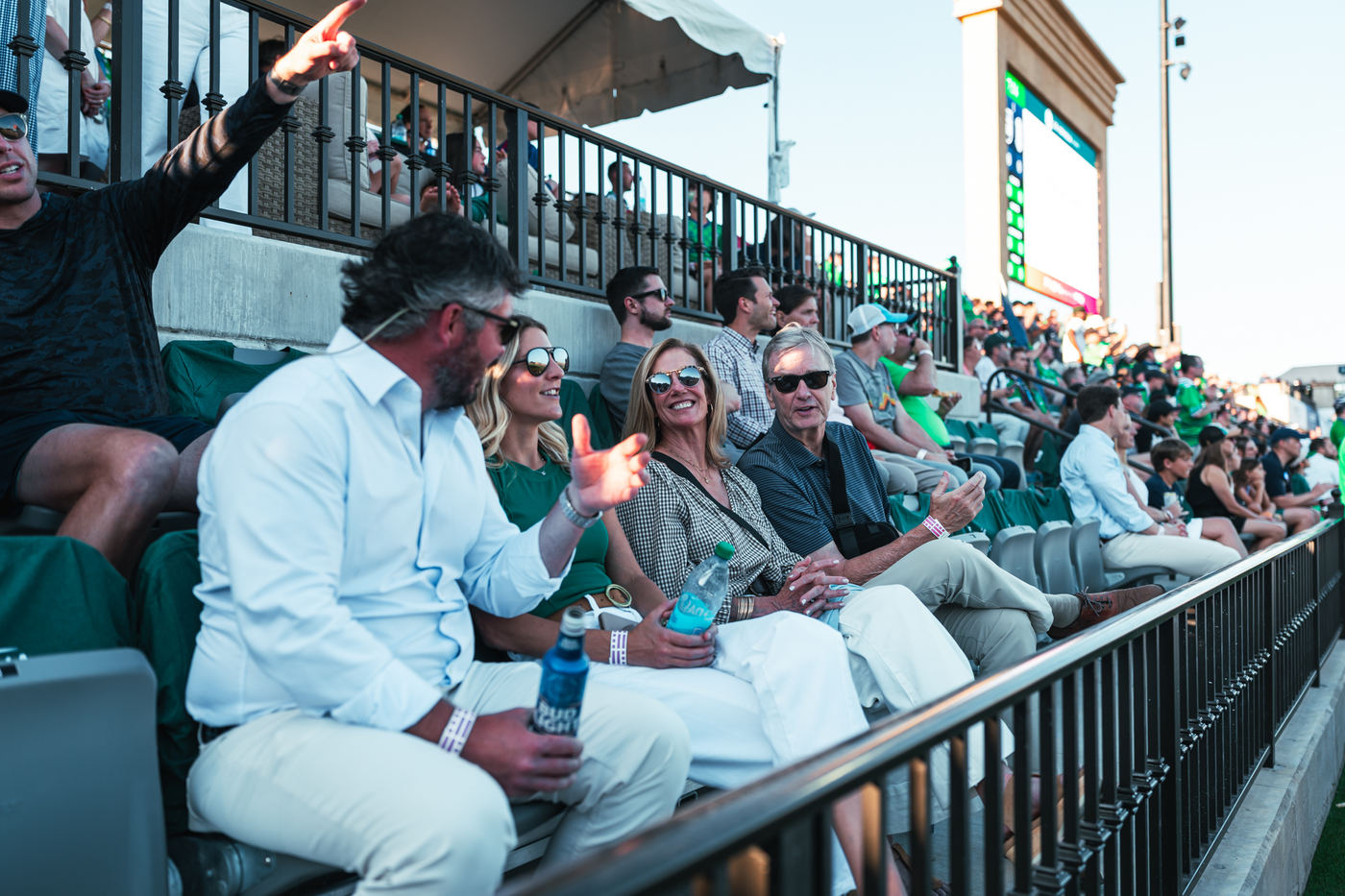 Guests in the front rows on the west sideline at GE Vernova Park on a 2026 matchday